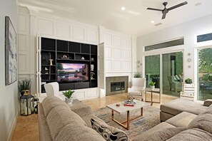 House | Living room | 65-inch Smart TV with satellite channels, fireplace, Netflix